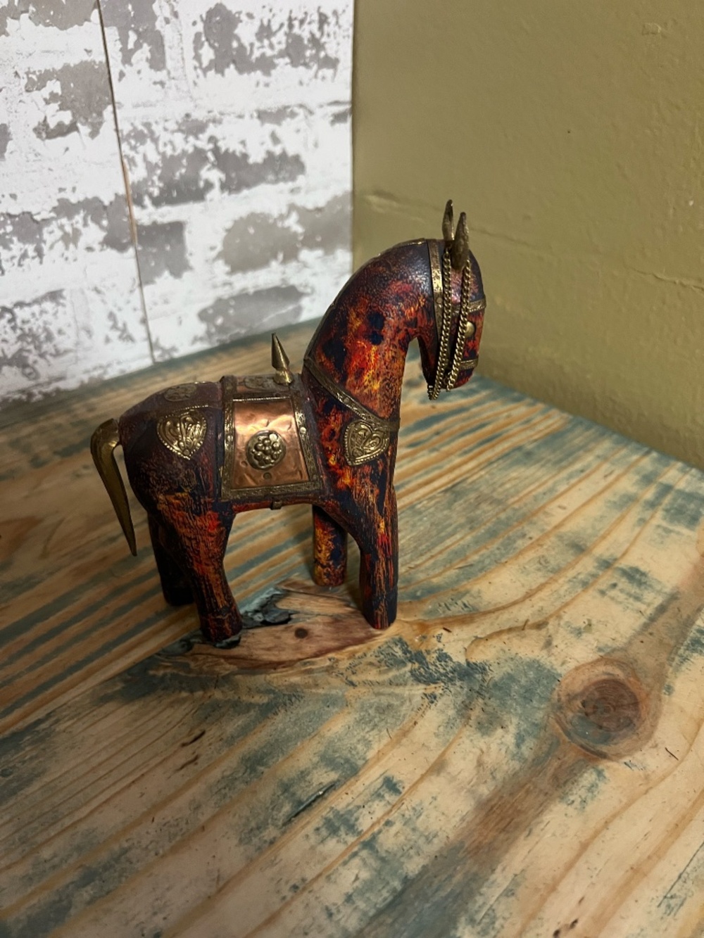 Vintage hand-carved wooden horse figurine from India, with decorative brass